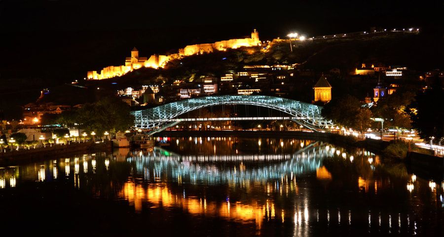 Night sightseeing Tbilisi in Mtkvari River Tourist Cruise Boat